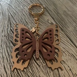 Gorgeous pink bronze metallic butterfly bag/key holder charm from Kate Spade.
